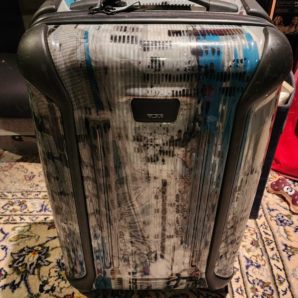 Grey Tumi Carry On Luggage